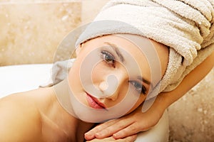 Woman relaxing bathtub.