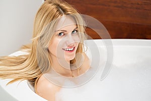 Woman relaxing in the bathtub