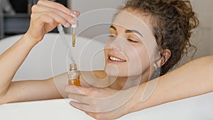 woman relaxing bathtub with serum. High quality photo