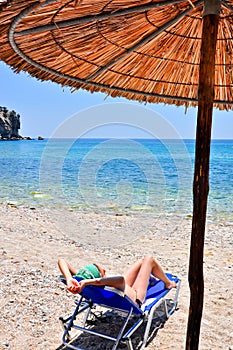 Woman relaxing at the beach