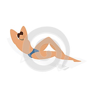 Woman relaxing on a beach chair, sunbathing in a blue bikini. Summer holiday and travel concept. Sun tanning and leisure