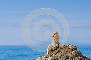 Woman relaxing on the beach in Greece