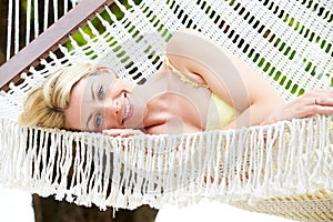 Woman Relaxing In Beach Hammock