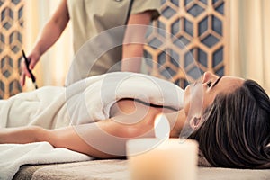 Woman relaxing at beauty center during treatment for skin rejuvenation