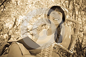 Woman relaxing in blossoming garden