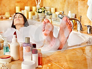 Woman relaxing at bubble bath.