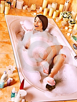 Woman relaxing at bubble bath.