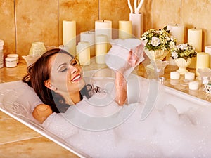 Woman relaxing at bubble bath