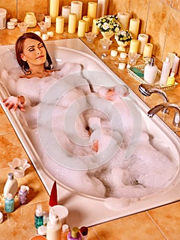 Woman relaxing at bubble bath