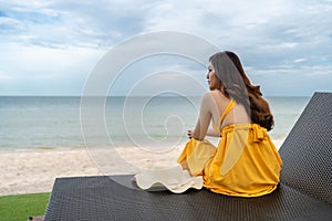 Woman relaxing on a chair in Hua Hin beach, Thailand