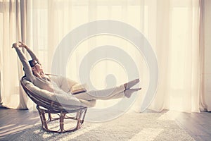 Woman relaxing in chair photo