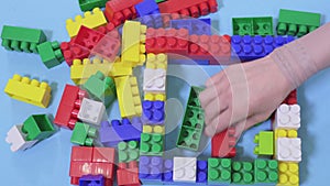 Woman relaxing with colorful plastic bricks