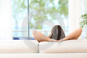 Woman relaxing on a couch at home