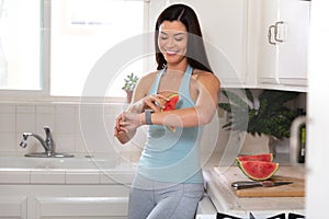 Woman relaxing eating watermelon fruit breakfast after morning yoga exercise, slimming low calorie meal, happy and healthy