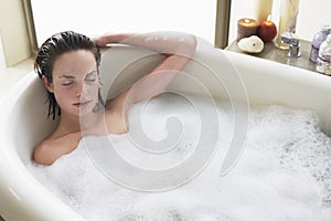 Woman Relaxing With Eyes Closed In Bathtub