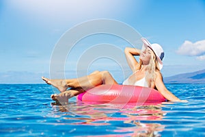 Woman relaxing and floating in the ocean