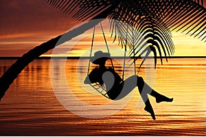 Woman relaxing in a hammock