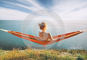 Woman relaxing in hammock