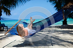 Woman relaxing in hammock