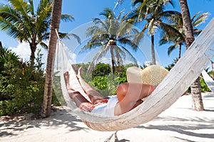 Woman relaxing in the hammock