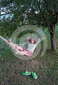 Woman relaxing in hammock