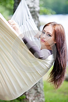 Woman relaxing in hammock