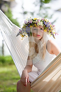 Woman relaxing in hammock