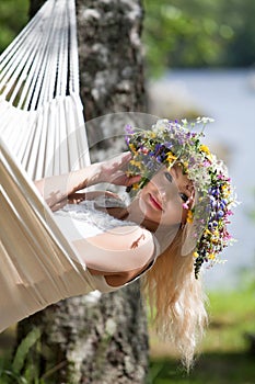 Woman relaxing in hammock