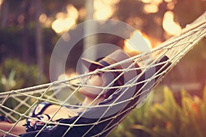 Woman relaxing in a hammock