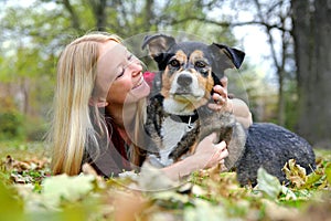 Woman Relaxing with her German Shepherd Dog on Fall Day