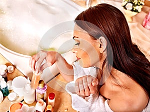 Woman relaxing at home bath.