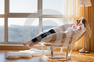 Woman relaxing at home photo