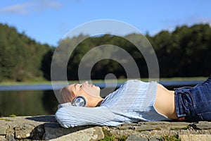 Woman relaxing listening to music with headphones