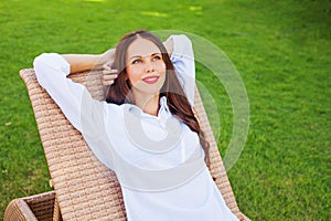 Woman relaxing in a lounger