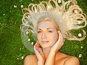 Woman relaxing on a meadow