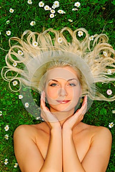 Woman relaxing on a meadow