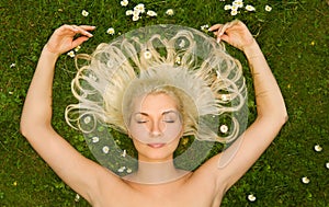 Woman relaxing on a meadow