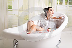 Woman relaxing in milk bath