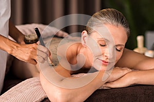 Woman relaxing during mud treatment