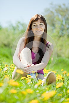 Woman relaxing outdoor in grass photo