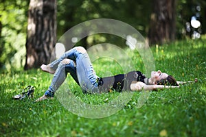 Woman relaxing outdoors looking happy and smiling