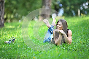 Woman relaxing outdoors looking happy and smiling