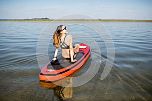 Woman relaxing on the paddleboard