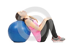 Woman relaxing on pilates ball