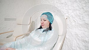 Woman relaxing in a salt cave