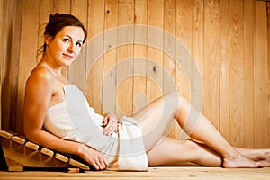 Woman relaxing in a sauna