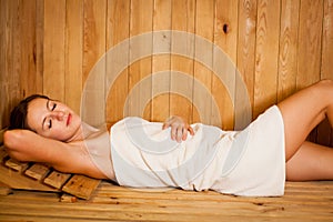 Woman relaxing in a sauna