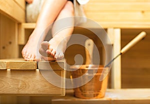 Woman relaxing in sauna.