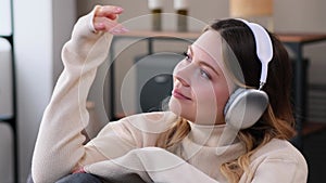 Woman Relaxing On Sofa And Enjoying Leisure With Music