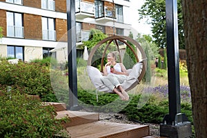 Woman relaxing at the spa. Relax in the garden.